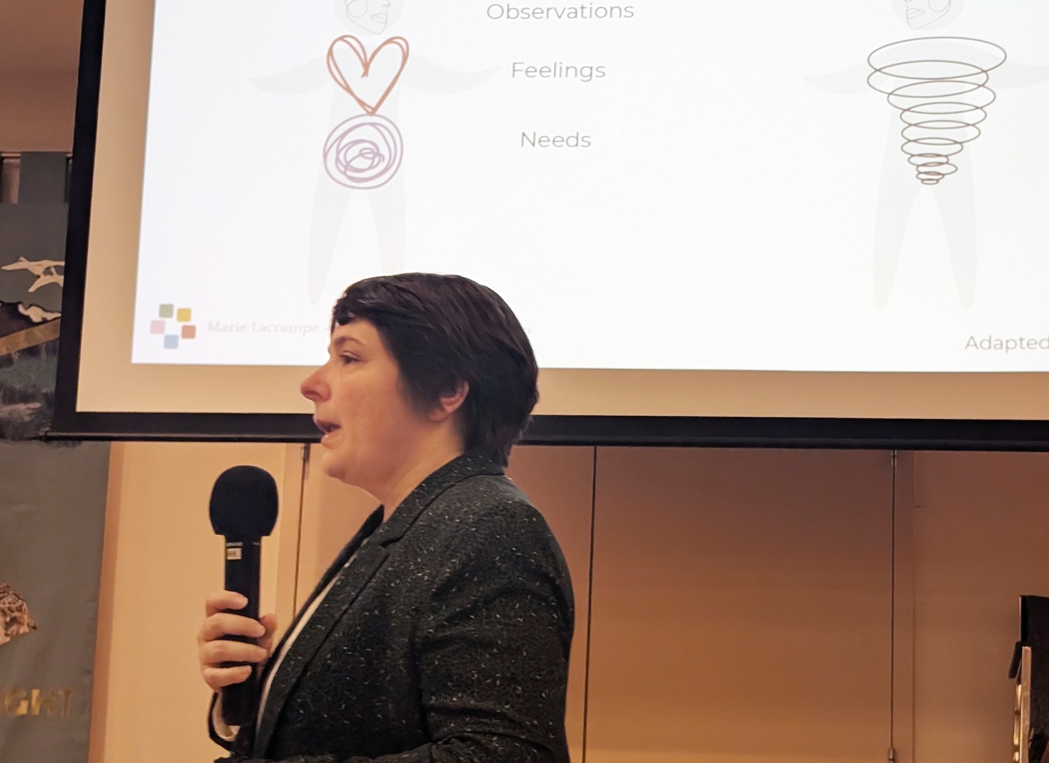 Marie Lacrampe speaking into a microphone